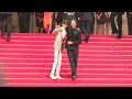 Timothée Chalamet and Adrien Brody stop to pose for photos together at the Cannes red carpet 2021