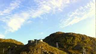 Timelapse of the sky fading out the clouds, with reindeer on the right side.