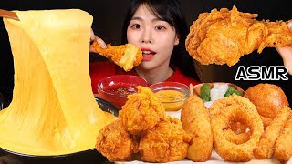 Cheese fondue, fried chicken, onion rings, cheese balls, cheese sticks, eating