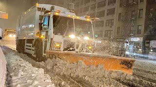 DSNY PLOWING 3RD AVENUE DURING WINTER STORM GAIL IN THE MIDTOWN AREA OF MANHATTAN IN NEW YORK CITY.