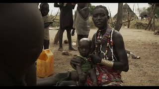 Toposa tribe woman breastfeeding her baby, Namorunyang State, Kapoeta, South Sudan