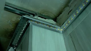 contour LED lighting and 3D effect on the glossy stretch ceiling in the bathroom.