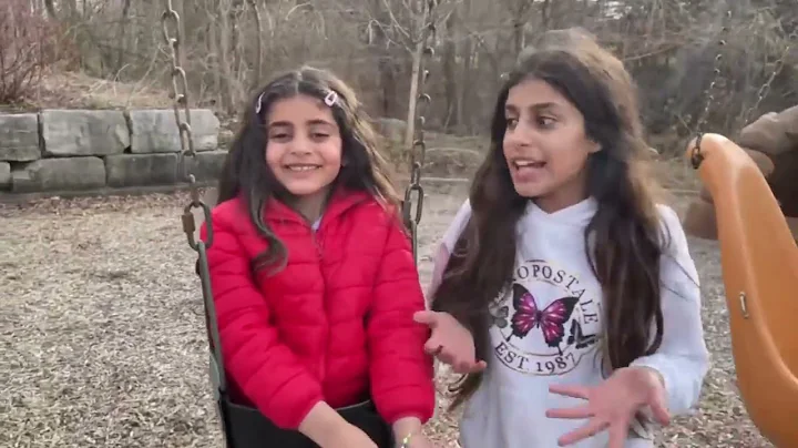 Deema and Sally play and get stuck in swing at the...