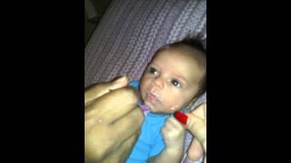 Greedy two month old eating cereal