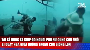 Tài xế dừng xe giúp đỡ người phụ nữ cùng con nhỏ bị quật ngã giữa đường trong cơn giông lớn | VTV24