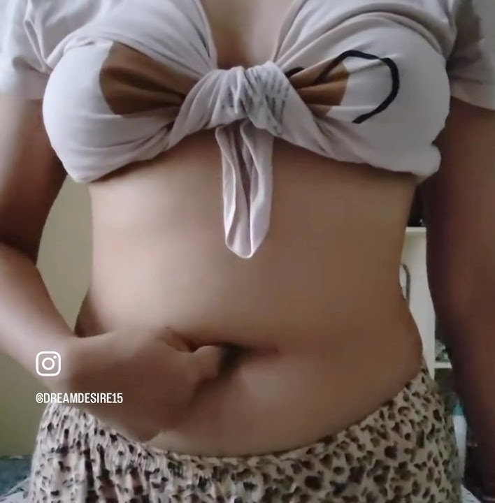 Girl fingering her deep belly button