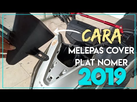 Video: Bagaimana cara melepas dudukan plat nomor?