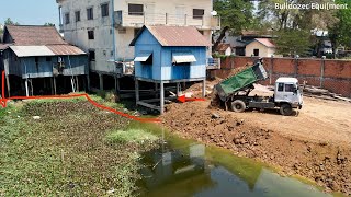 Bulldozer Working Pushing Sticky Clay Filling Pond And Dump Truck Dumping Sticky Clay.