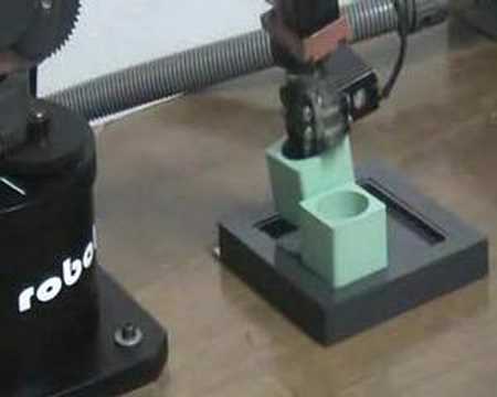 Mini Robot stacking blocks.