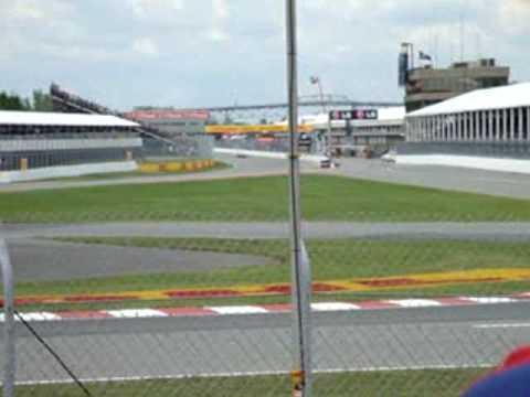 The last few minutes of qualifying in Canada trackside, with Lewis Hamilton getting the pole position. Hamilton runs out of fuel on the in-lap and gets out of the car to push it.