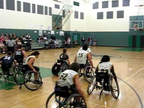 Wheelchair basketball player Nick Weiss makes a ba...