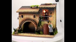 Illuminated house with moving lamplighter 12 cm and woman opening the window 45x30x35 cm h video