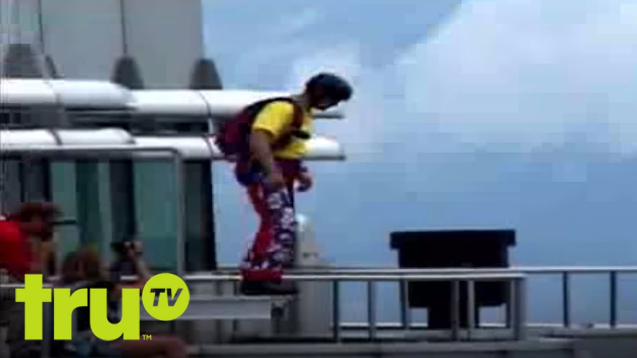 World's Wildest Vacation Videos -  Ooops Parachute - A base jumper plunges from the Petronas Towers in Malaysia.