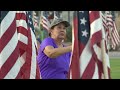 Volunteers place flags for Tempe Healing Field tribute