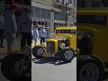 American Graffiti style 1932 Ford Hot Rod coupe rolls out to Paradise road during classic car show