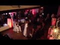 The bride and bridal party serenade the groom in dance