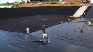 HDPE waste storage Pulling 60 mil HDPE liner PA1