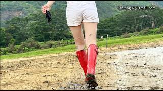 311期Barefoot, Wearing Boat Socks And Red Rain Boots, Stuck In The Mud.