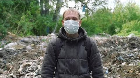 Man Standing By Garbage Dump Stock Video