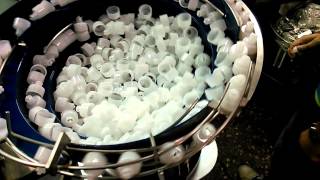 Detergent cap assembling machine trial