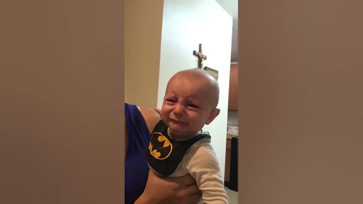 Baby does not like that dad trimmed his beard