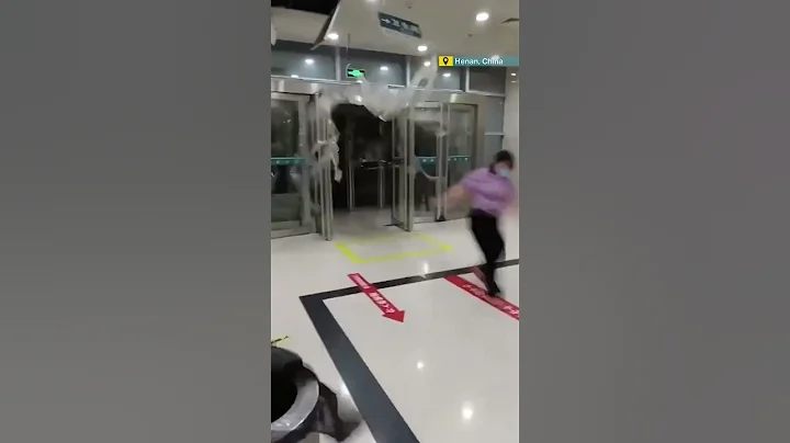 Strong winds push woman into building