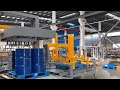 Low lever palletizer for drums  with pallet dispensor and conveyor system