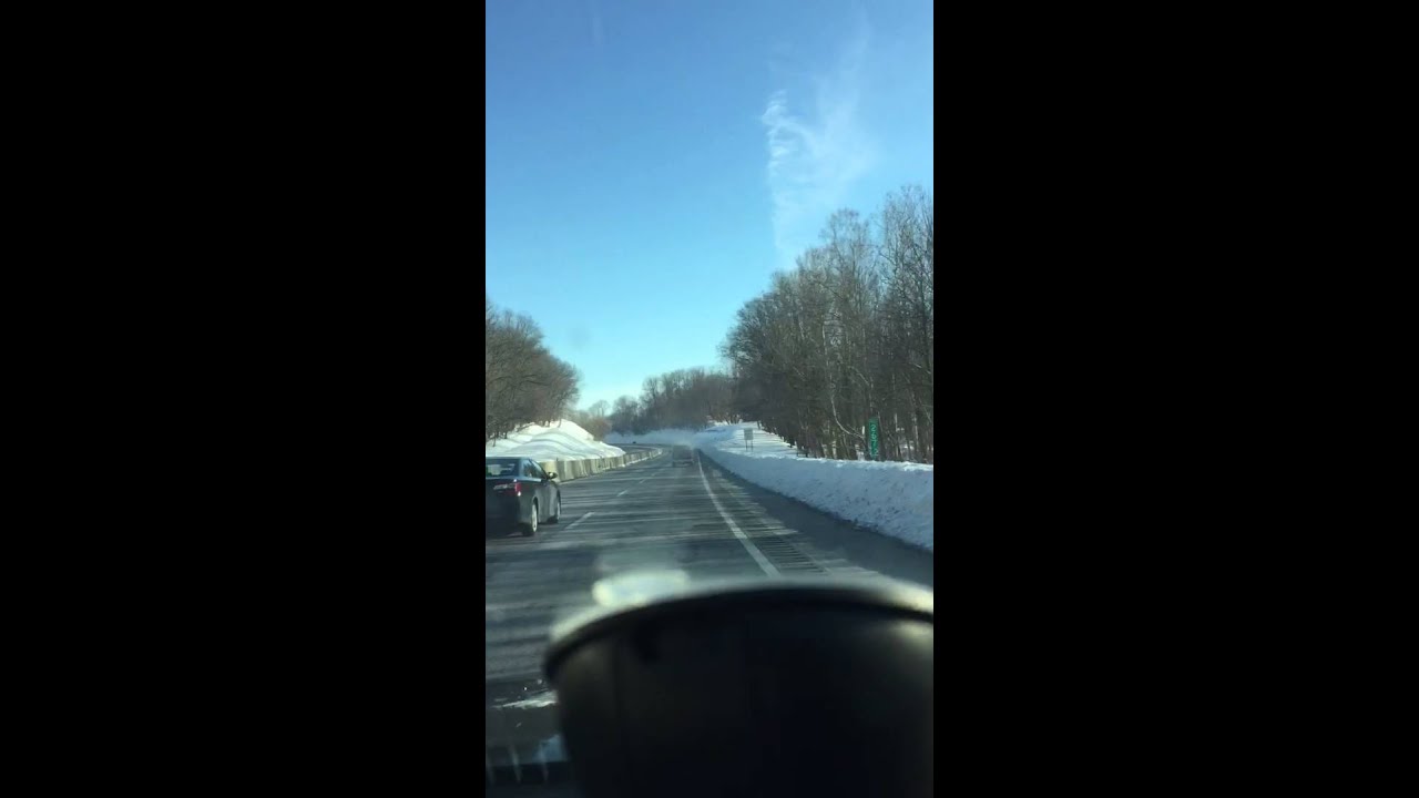 Blizzard 2016. Dangerous snow blowing off roofs of trucks.
