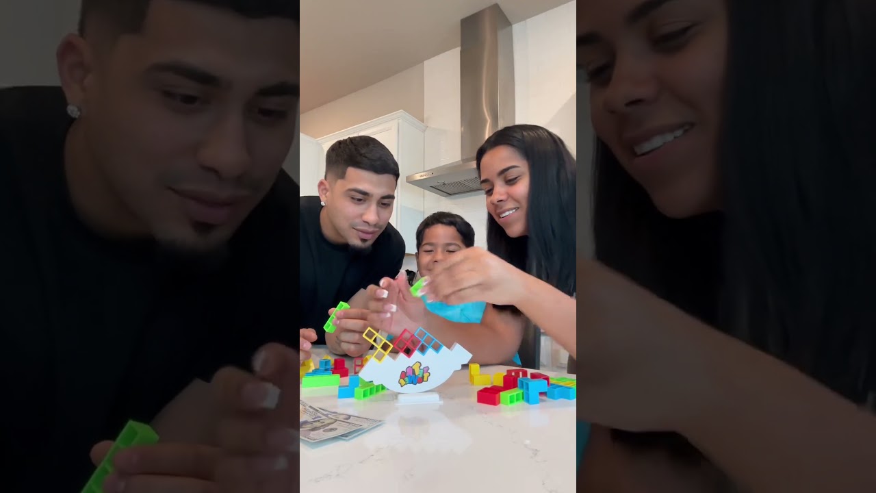 Mom dad and son play fun game, whoever wins gets money 