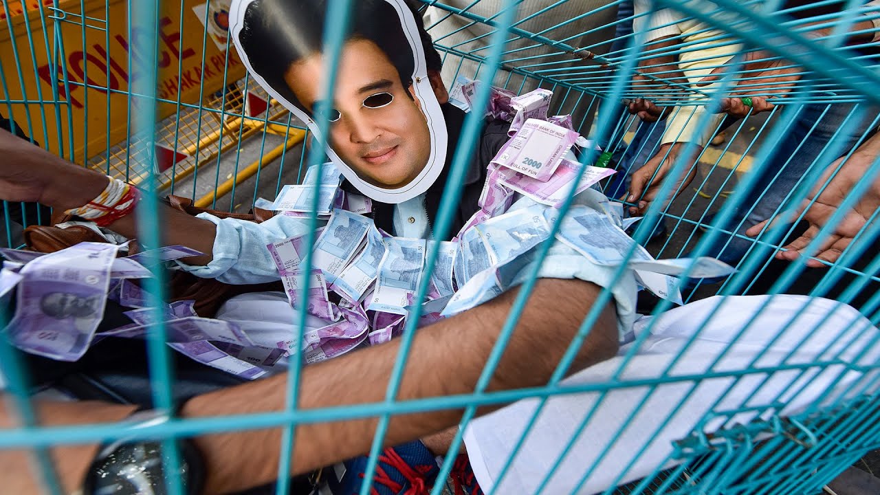 New Delhi: Youth Congress activists stage a symbolic protest against horse trading by BJP