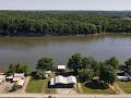 #5559- WATERFRONT LAND FOR SALE ON THE TN RIVER WITH FULL RV HOOKUPS, PADS, COVERS, BOATSLIPS