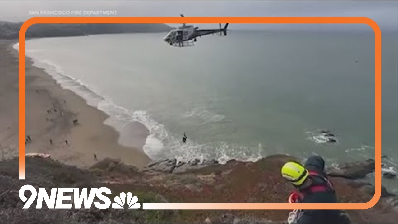 Amazing rescue caught on camera after man dangles off cliff in ...