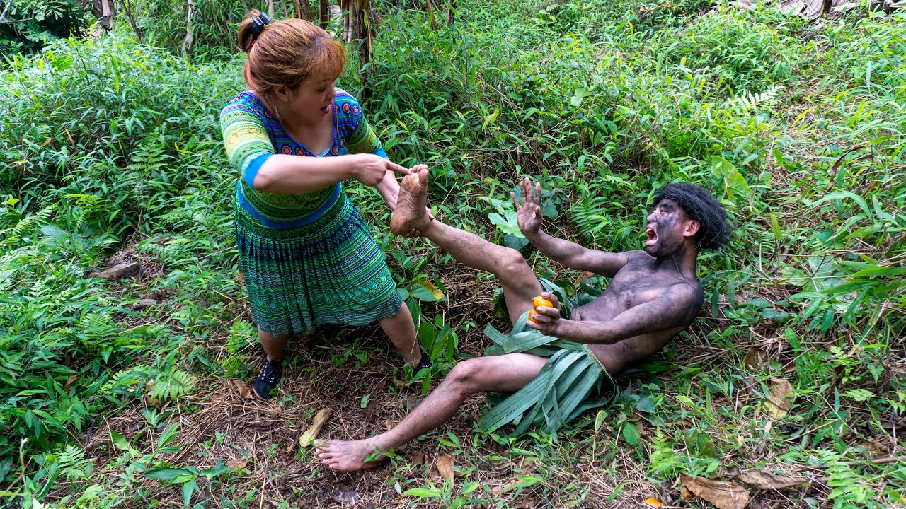 Primitive life Caught in the act of a forest man stealing oranges the girl reminded him not to steal