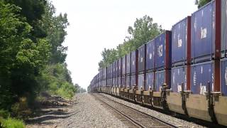 CSX with UP power double stack train starting downgrade after Cambell hill.