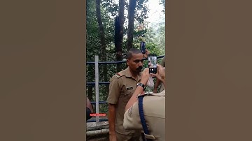 kerala police and ayyappa devotees taking photos of forest squirrel at sabarimala pilgrimage| status