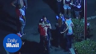 Survivors of California music bar shooting seen hugging and crying