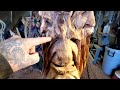 Cutting out a big nose with a Chainsaw or even Dremel  to Create any type of face you want.