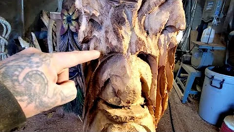 Cutting out a big nose with a Chainsaw or even Dremel  to Create any type of face you want.