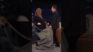 JIMMY FALLON AND STELLA MCCARTHY CELEBRATE 25YEARS WITH A GIANT FALABELLA BAG STUNT  #ivoguetv