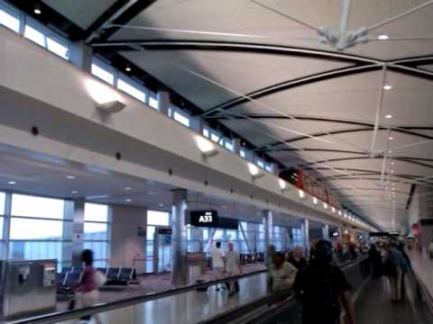 There's a tram running between terminals at the Detroit Metropolitan Wayne County Airport. It runs within the building, as seen here at the McNamara terminal.