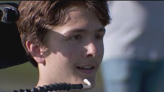 Paralyzed football player attends first game