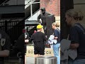 Fans stop and take pictures, place flowers at Bobby Cox statue