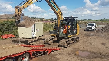 Loading excavator on to trailer