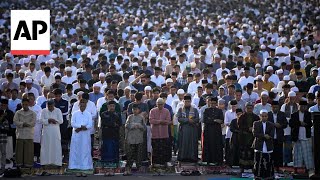 Indonesian Muslims hold Eid al-Fitr prayers to mark the end of Ramadan