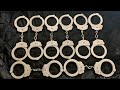 Eight vintage Peerless handcuffs. Model 300s, model 400s and model 500. 