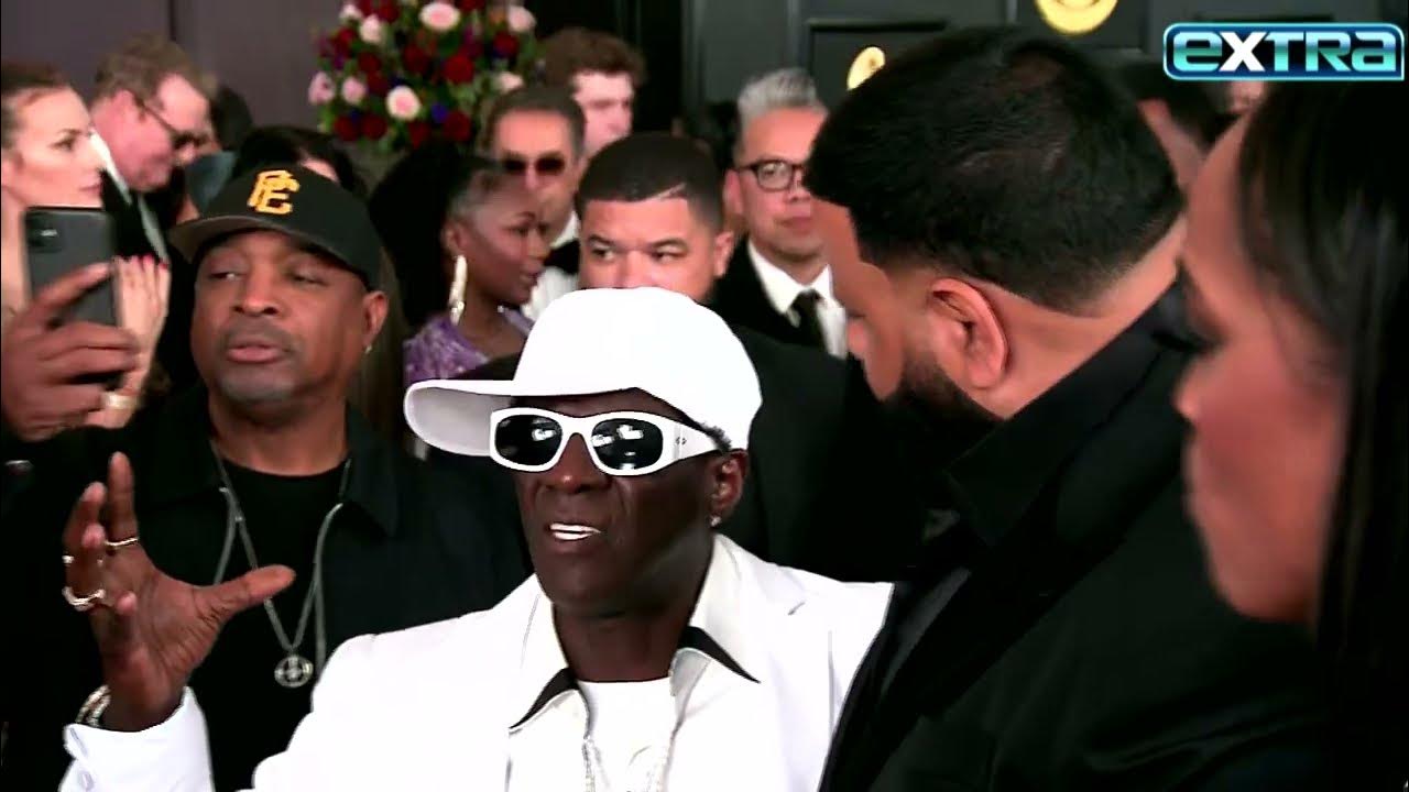 Watch Flavor Flav CRASH DJ Khaled’s Grammys Interview! (Exclusive