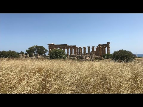 How did the Greeks and Romans build colossal temples?