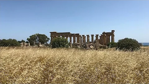 How did the Greeks and Romans build colossal temples?