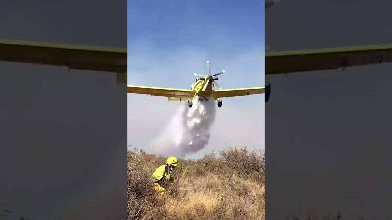 Single engine air tanker flying low to drop. 