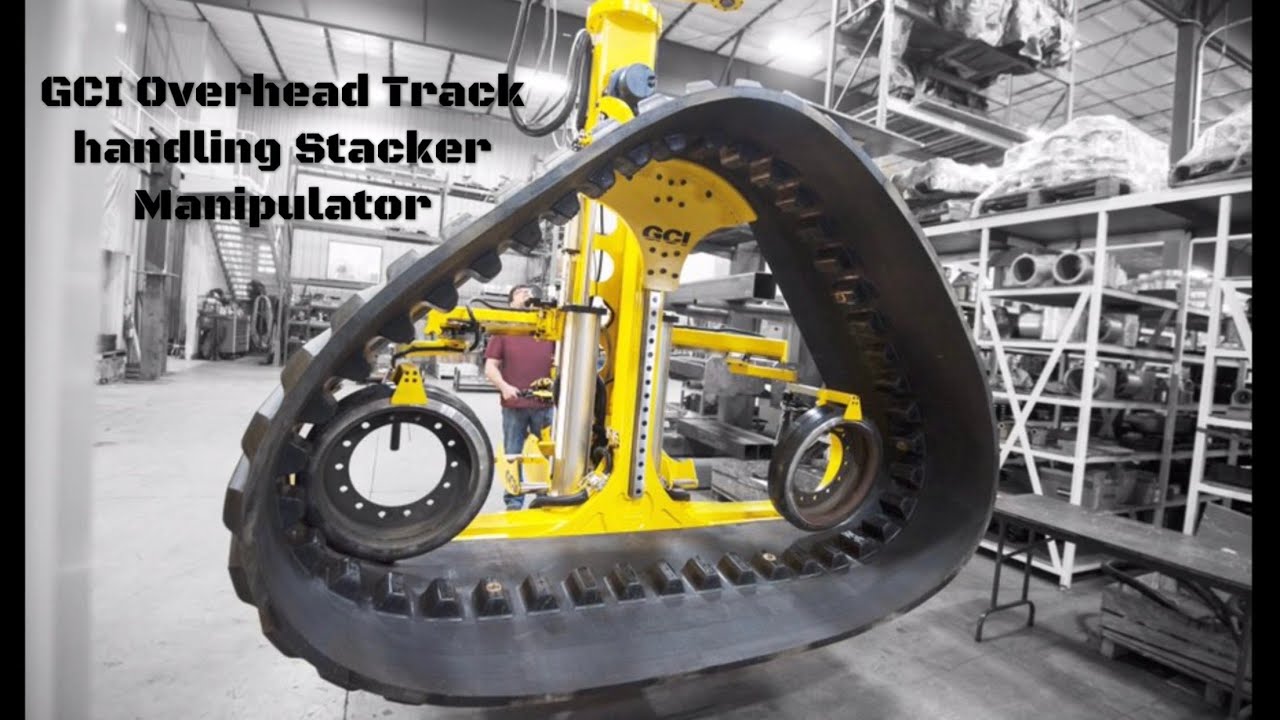 Stacker Manipulator Handles Huge Tractor Track - GCI Industrial Manipulators